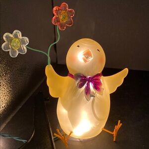 Easter Chick Holding Flowers